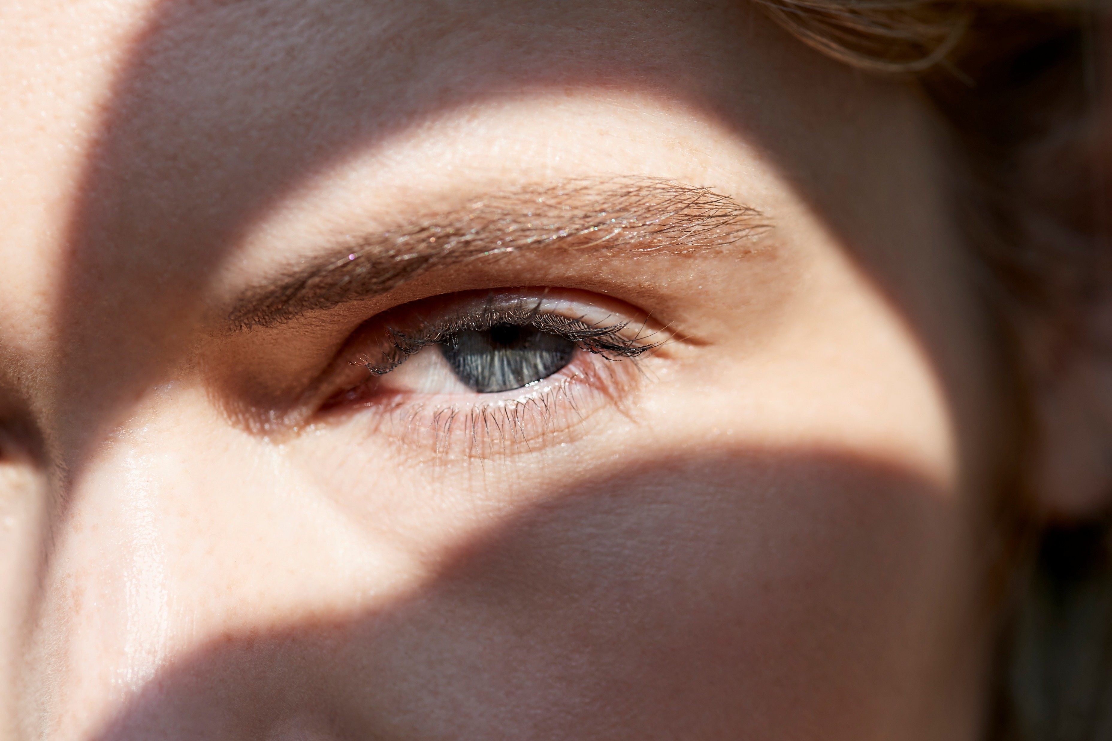 Close up of a woman looking through a window