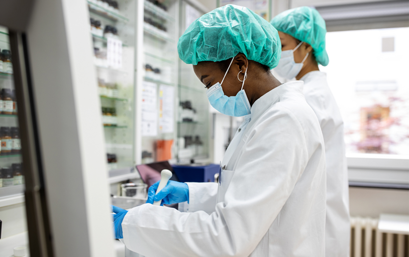 Two lab workers testing blood